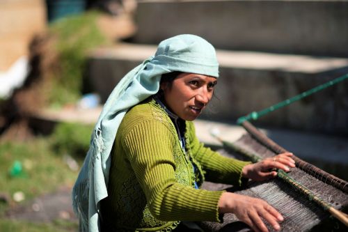 Faces of Guatemala: Woman weaving a carpet